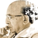 alzheimer, l'immagine della testa di un uomo che come in un puzzle perde pezzi