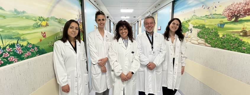 slcerosi tuberosa a group of people in white coats standing in a hallway