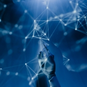 a robotic hand reaching into a digital network on a blue background, symbolizing ai technology.